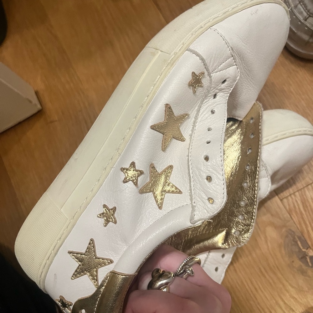 J slides gold and white star sneakers